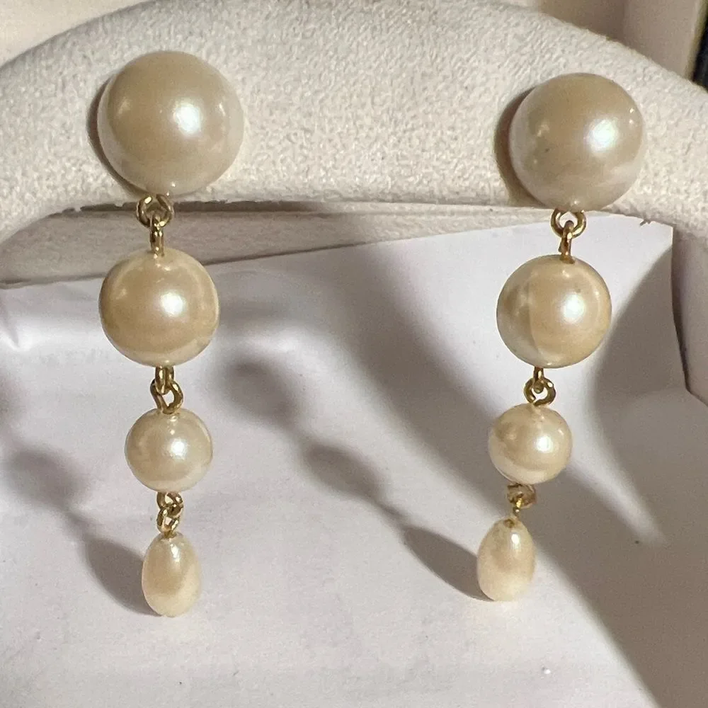 Faux pearl dangle pierced earrings.